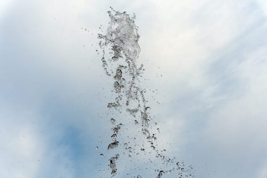 water spurt detail isolated on sky background