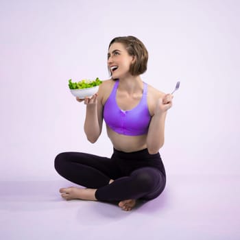 Full body length gaiety shot athletic and sporty young woman with healthy vegan food in standing posture on isolated background. Healthy active and body care by vegetarian lifestyle.