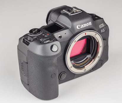mirrorless digital camera body Canon R5 without lens on white background with focus stacking - Tula, Russia, September 15, 2021