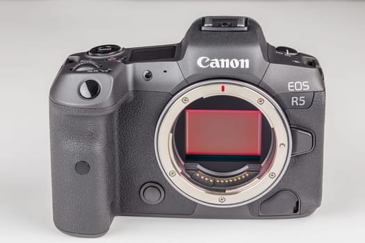 mirrorless digital camera body Canon R5 without lens on white background with focus stacking - Tula, Russia, September 15, 2021