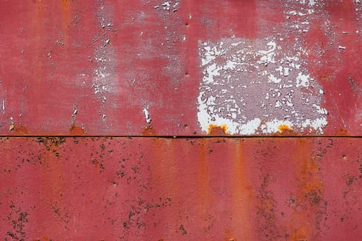 rusty red painted flat sheet metal surface full-frame background and texture.