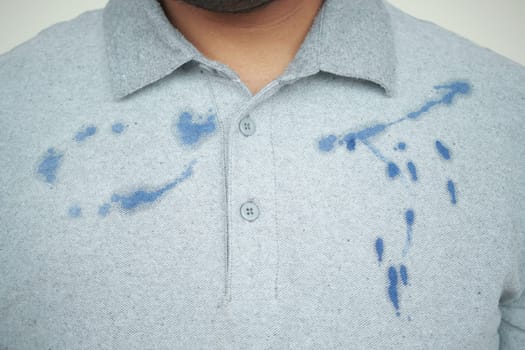 shirt with blue ink stain