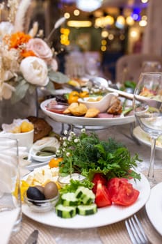 An assortment of delicious food on a table, including vegetables, cheese, pastries, and other tasty treats.