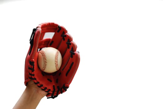 Hand in leather baseball glove catching ball isolated on white background.