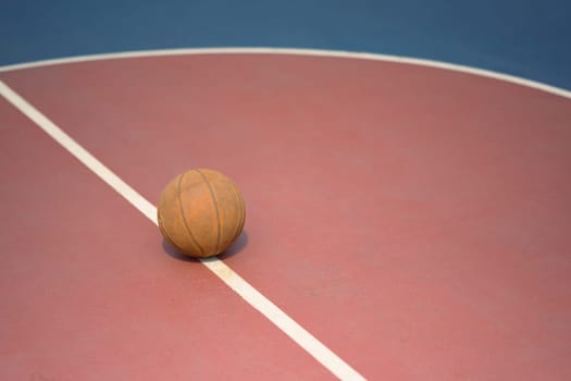 Basketball on the floor in sport gym. Sport, training and competition concept.