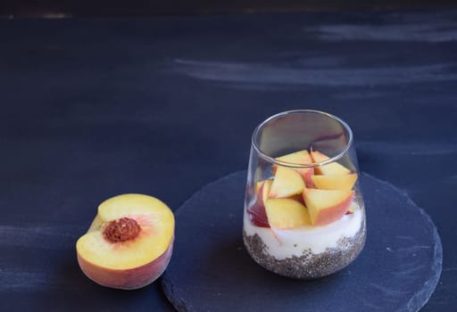Healthy breakfast with chia seeds, yogurt, fruit and honey.