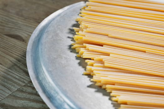 Dried pasta spaghetti on table  , preparing food , traditional italian food