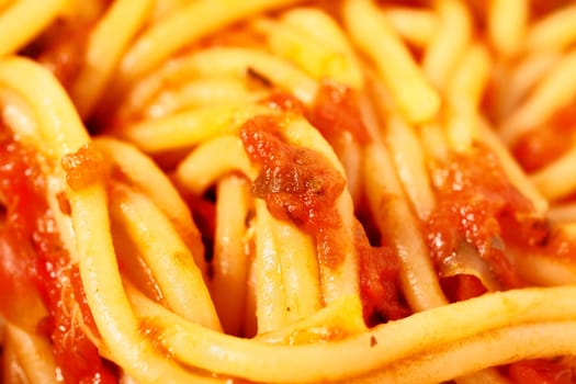 Full frame of pasta spaghetti and tomato sauce , traditional italian food
