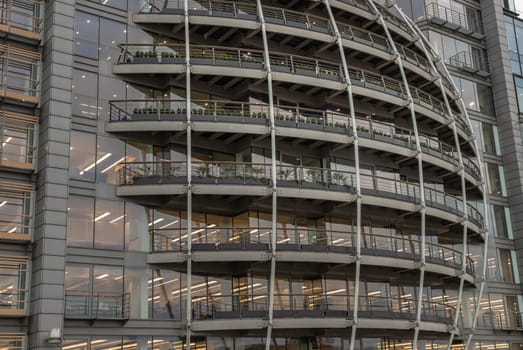 London, UK - Feb 27, 2024 - Modern architectural design of Riverside House. Exterior detail of Curved building along the River Thames of the City of London. Copy space, Selective focus.