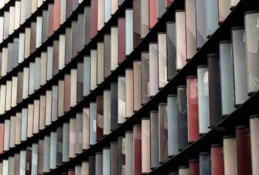 London, UK - Feb 27, 2024 - Colourful panels on the exterior on Modern architecture of Mizuho bank office building (2 New Ludgate) in city of london. Abstract multi coloured modern architecture, Block windows, Space for text, Selective focus.