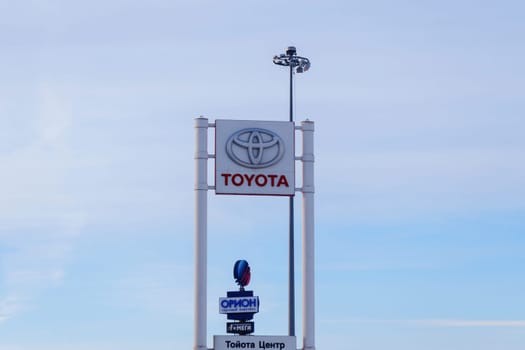 Tyumen, Russia-March 02, 2024: Toyota logo Sign Against Blue Sky. Selective focus