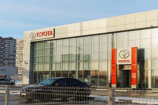 Tyumen, Russia-March 02, 2024: Toyota sign standing prominently against a clear blue sky, showcasing the iconic brand logo