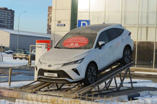 Tyumen, Russia-March 02, 2024: Toyota Venza is showcased on an inclined ramp outside a showroom.