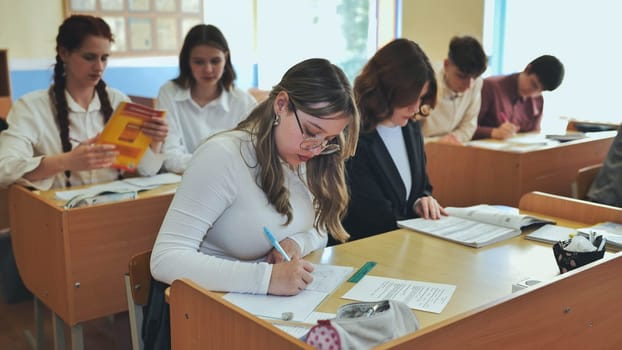 High school students sitting at a desk