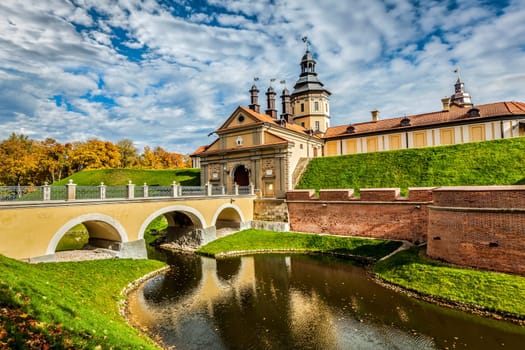 Belarusian tourist landmark attraction Nesvizh Castle - medieval castle in autumn. Nesvizh, Belarus