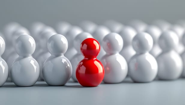 The unique red figurine stands out from the crowd of white, symbolizing ambition, success, and the confidence to rise above competition and shine as a leader and winner