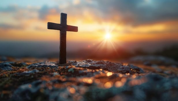 The cross on the mountain at sunset. The concept of the crucifixion of Jesus Christ.