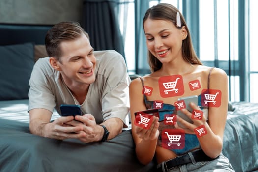 Elegant female and male customer with credit card control mobile phone choosing online platform. Smart consumers opening e-commerce application using cashless technology shopping inventory. Cybercash.