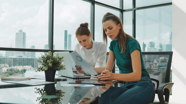 Skilled businesswoman look stress while discuss about financial strategy. Smart business team brainstorming, talking consulting sales plan, idea by using statistic document with tension. Tracery