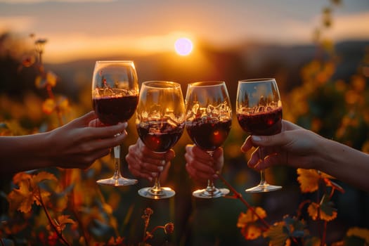 A group of people are raising wine glasses in a vineyard at sunset, against the backdrop of a stunning natural landscape with the sky painted in hues of orange and pink