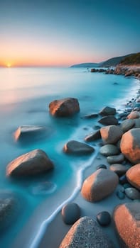 Beautiful seascape at sunset. Composition of nature.Beautiful sunset over the sea. Colorful summer landscape. Long exposure.Beautiful seascape with pebbles on the beach at sunset.