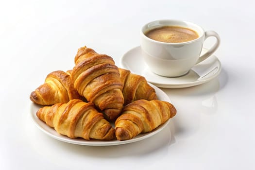 Croissants isolated on plate on pastel colors wooden background with hot coffee drink.Cup of coffee and croissants on background.Freshly baked croissants and cup of coffee.French breakfast.Breakfast concept.