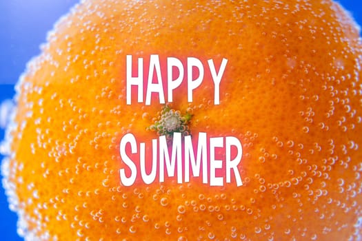Happy Summer Greetings Emblazoned on Orange Slice. Selective focus