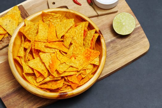 Bowl is filled with crispy tortilla chips, creating a savory snack ready to be enjoyed.