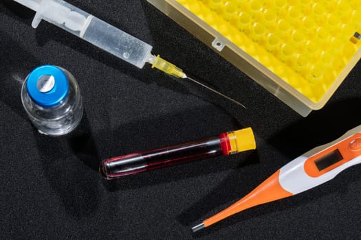 Each blood vial is transported to the laboratory for specialized tests.