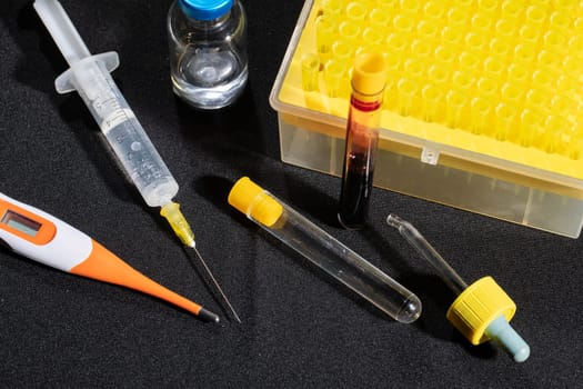 Each blood vial is transported to the laboratory for specialized tests.