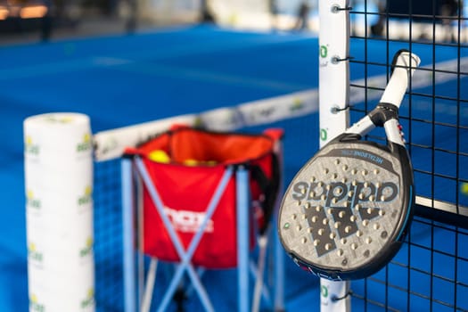 Kyiv, Ukraine. March 22, 2024 paddle tennis objects in court, racket, balls and fences. High quality photo