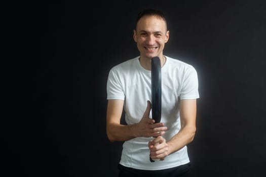 Man ready for paddle tennis serve in studio shot. High quality photo