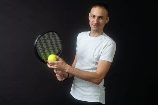 one caucasian mature man Paddle Padel tennis player shadow silhouette in studio isolated on black background. High quality photo