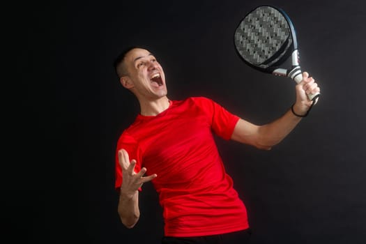 Paddle tennis: Man, Player with hand and Paddel racket and ball . High quality photo