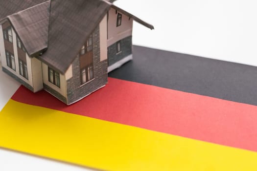 Small house on a flag - Living or migrating to Germany. High quality photo