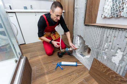 Construction man using hammer and tool while demolish wall. High quality photo