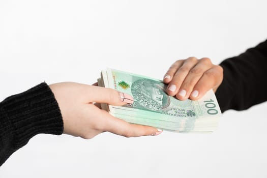 On the zoom you can see female hands full of banknotes as they exchange cash.