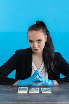 A bank employee in her position prepared for issuing a bundle of banknotes.