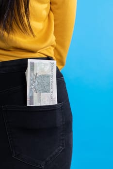 A cash file in the back pocket is a sign of financial wealth.