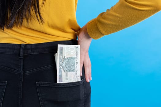 A cash file in the back pocket is a sign of financial wealth.