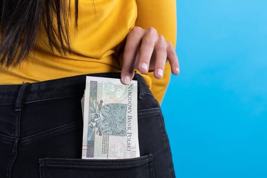 A cash file in the back pocket is a sign of financial wealth.