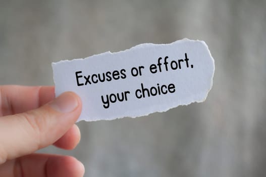Excuses or effort, your choice text on torn paper with blur background.