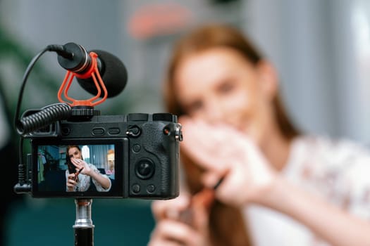Woman influencer shoot live streaming vlog video review makeup utmost social media or blog. Happy young girl with cosmetics studio lighting for marketing recording session broadcasting online.
