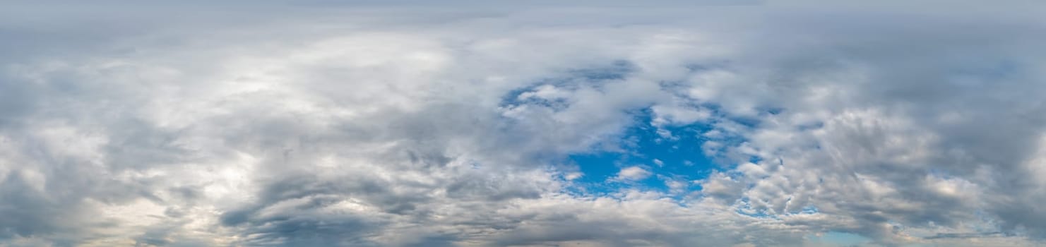 Blue sky with Cumulus clouds Seamless panorama in spherical equirectangular format. Complete zenith for use in 3D graphics, game and for composites in aerial drone 360 degree panoramas as a sky dome.