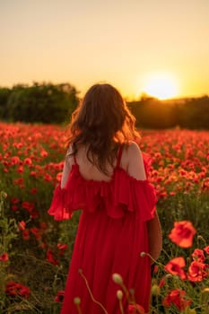 Woman poppy field red dress sunset. Happy woman in a long red dress in a beautiful large poppy field. Blond stands with her back posing on a large field of red poppies.