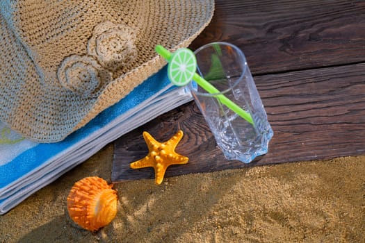 Summer hat for a holiday. An empty glass for a refreshing drink.