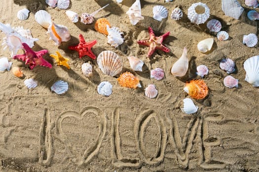 A tourist wrote on the sand - I love. Relaxing climate of a sea sandy and sunny beach.