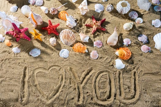 A tourist wrote on the sand - I love. Relaxing climate of a sea sandy and sunny beach.