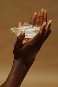 Close-up of hand applying moisturizer, representing skincare and hydration.