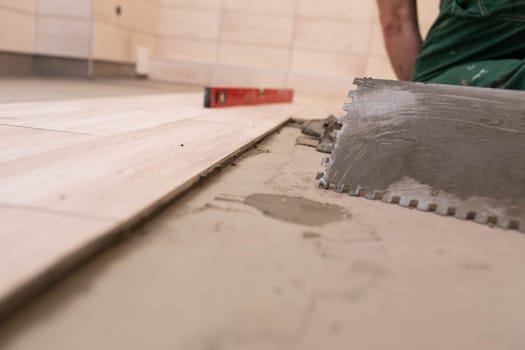 Hand tool. Metal trowel with square teeth cut out. A tool used for tiling cement and terracotta with cement glue.